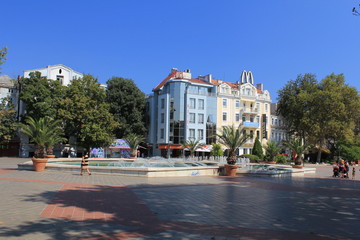 view of the square with a fountain and restored colored houses
