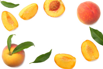 peach fruit with green leaf and slices isolated on white background. top view