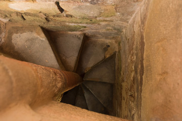 View down to the stone stairs in the old defence tower of Punta de N'Amer near Sa Coma, on the Spanish Balearic Mediterranean island Mallorca