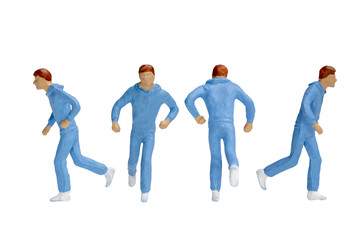 Fototapeta premium Miniature people running isolated on white background with clipping path 