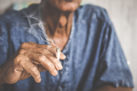 Asian Male Hand Holding Cigarette  Smoking,unhealthy Living Lifestyle Concept 