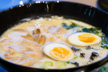 delicious japan food style menu.traditional japanese local Ramen noodle on black dish.japanese chef cooking Ramen noodles at japanese restaurant.tasty japanese food served on dish.