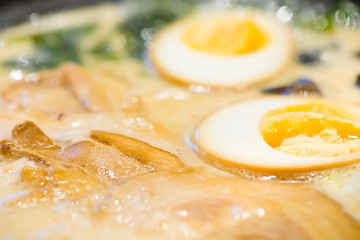 delicious japan food style menu.traditional japanese local Ramen noodle on black dish.japanese chef cooking Ramen noodles at japanese restaurant.tasty japanese food served on dish.