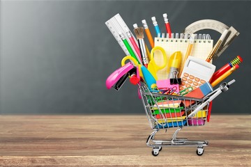Stationery objects in mini supermarket cart