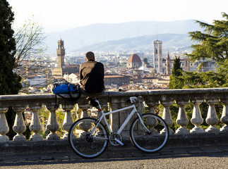 view of Florence with cyclist and bike