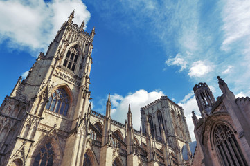 Fototapeta premium Elaborate tracery on exterior building of York Minster, the historic cathedral built in English gothic architectural style located in City of York, England, UK