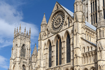 Fototapeta na wymiar Elaborate tracery on exterior building of York Minster, the historic cathedral built in English gothic architectural style located in City of York, England, UK