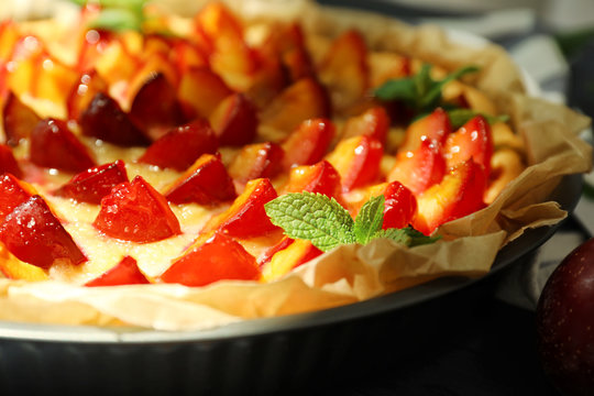 Delicious pie with plums, closeup