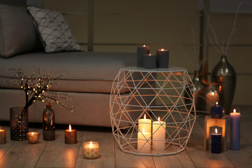 Cozy room decorated with burning candles