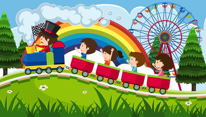Children riding a train in fun park