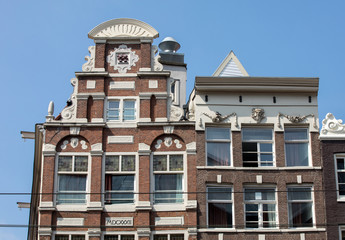 Typical gabled houses on Damrak street in Amsterdam, Holland, Netherlands