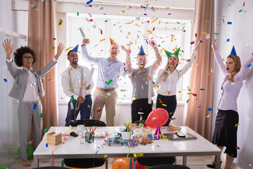 Group Of Businesspeople Celebrating In Office