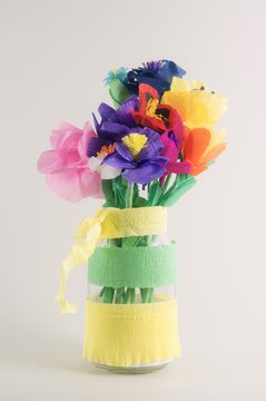 Origami flowers. Paper flowers. Handmade flowers on a grey  background.