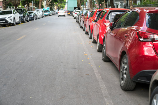 Parallel parking cars on urban street. Outdoor parking on road