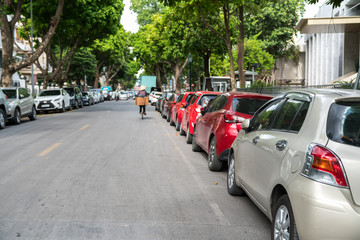 Parallel parking cars on urban street. Outdoor parking on road