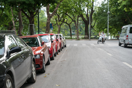 Parallel parking cars on urban street. Outdoor parking on road