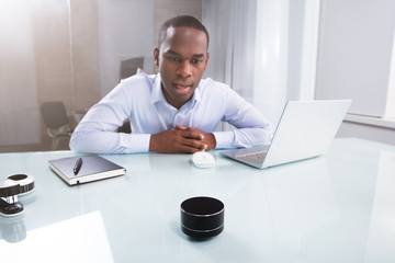 Fototapeta premium Businessman Speaking On Wireless Speaker