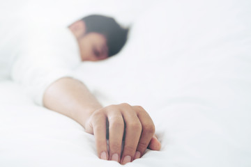 Young man sleep in bed in the bedroom.