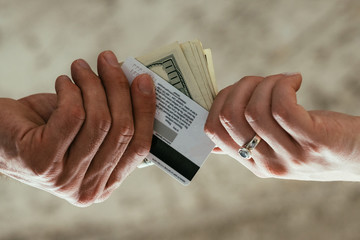financial and accounting fraud. illegal money withdrawal. tax dodging. two pairs of hands...
