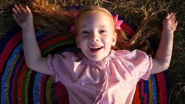 Cute little girl portrait funny open her face and cheerfully smile on camera