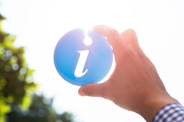 Man holding information icon