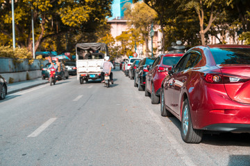 Parallel parking cars on urban street. Outdoor parking on road
