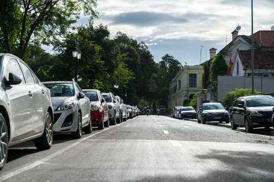 Parallel parking cars on urban street. Outdoor parking on road