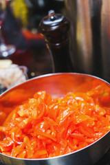 Sliced cherry tomatoes for salad and sauce preparation for main courses. 