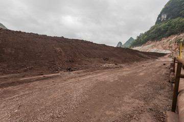 Fototapeta na wymiar gravel road and mound in mining area