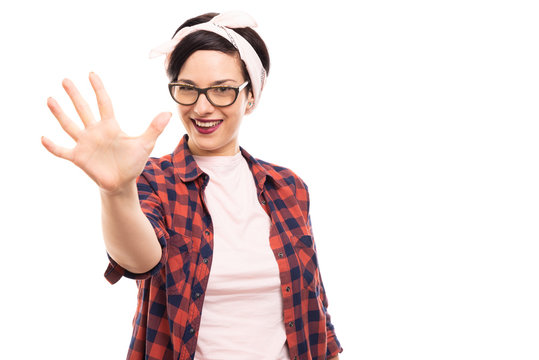Pretty pin-up girl wearing glasses showing number five with fingers.