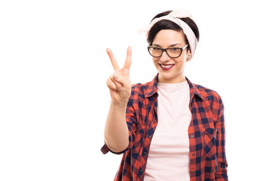 Pretty pin-up girl wearing glasses showing number two with fingers.