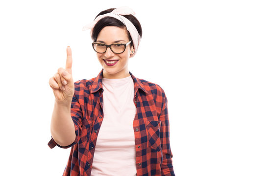 Pretty pin-up girl wearing glasses showing number one with finger.