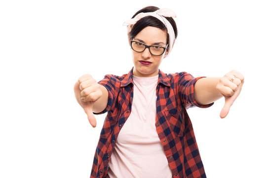 Pretty pin-up girl wearing glasses showing double thumb down gesture.