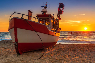 Fishing boat parked on the beach