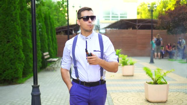 Stylish man with shirt with electronic cigarette.