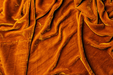 top view of orange velvet textile as background