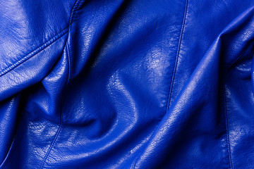 Fototapeta premium top view of dark blue leather shiny textile as background