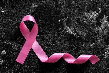 Pink ribbon on grunge background. Breast cancer awareness concept