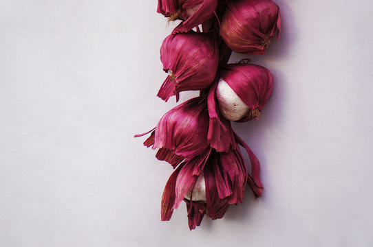 Hanging bunch bundle of red onion