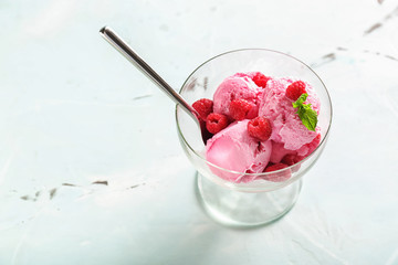 Dessert bowl with tasty raspberry ice-cream on table