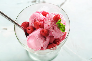 Dessert bowl with tasty raspberry ice-cream on table