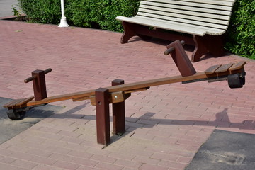 Old wooden seesaw board. Wooden plank balancing. well-equipped playground