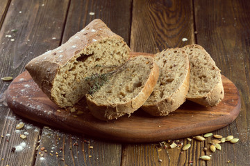 baked bread on wooden table background