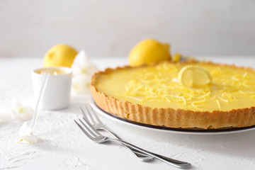 Tasty lemon pie on table, closeup