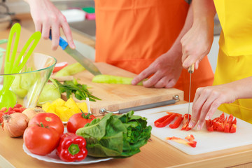 Couple preparing fresh vegetables food salad