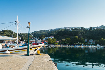 Ships in Loutraki, Glossa harbor at summer morning, Skiathos island, Greece