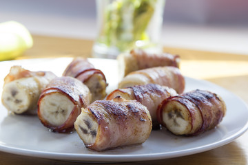 Bananas, wrapped in bacon and grilled
