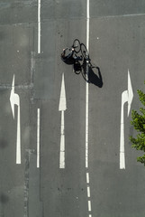 Cyclist seen from above on a urban street.