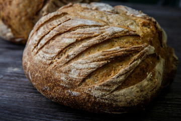 closeup whole handmade round white wheat bread