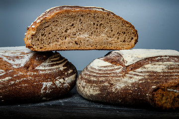 closeup three pieces of handmade round  brown rye bread